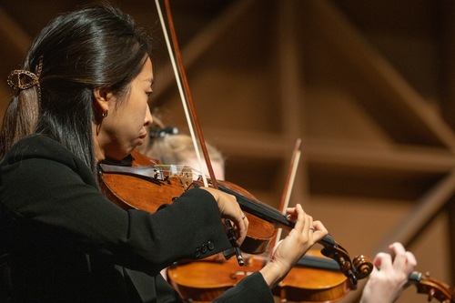 An idividual playing violin 