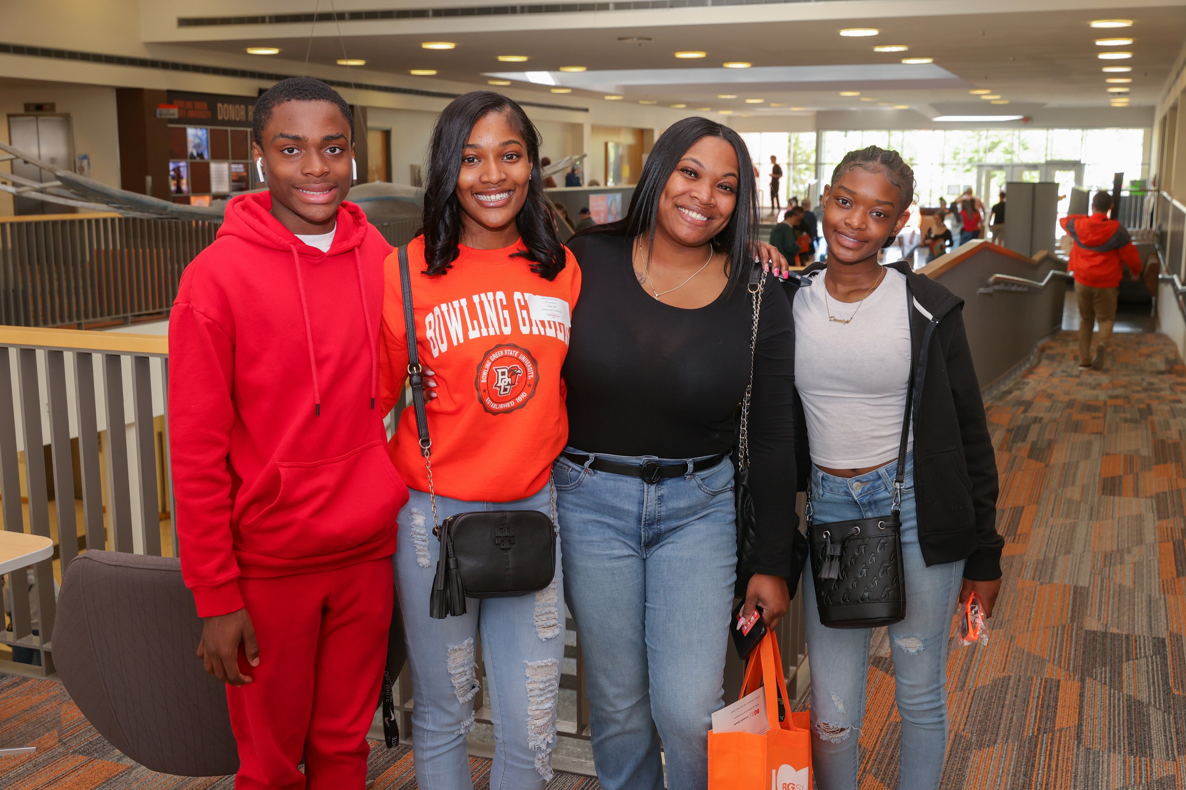 A Falcon family poses with their new BGSU student at the Bowen-Thompson Student Union.