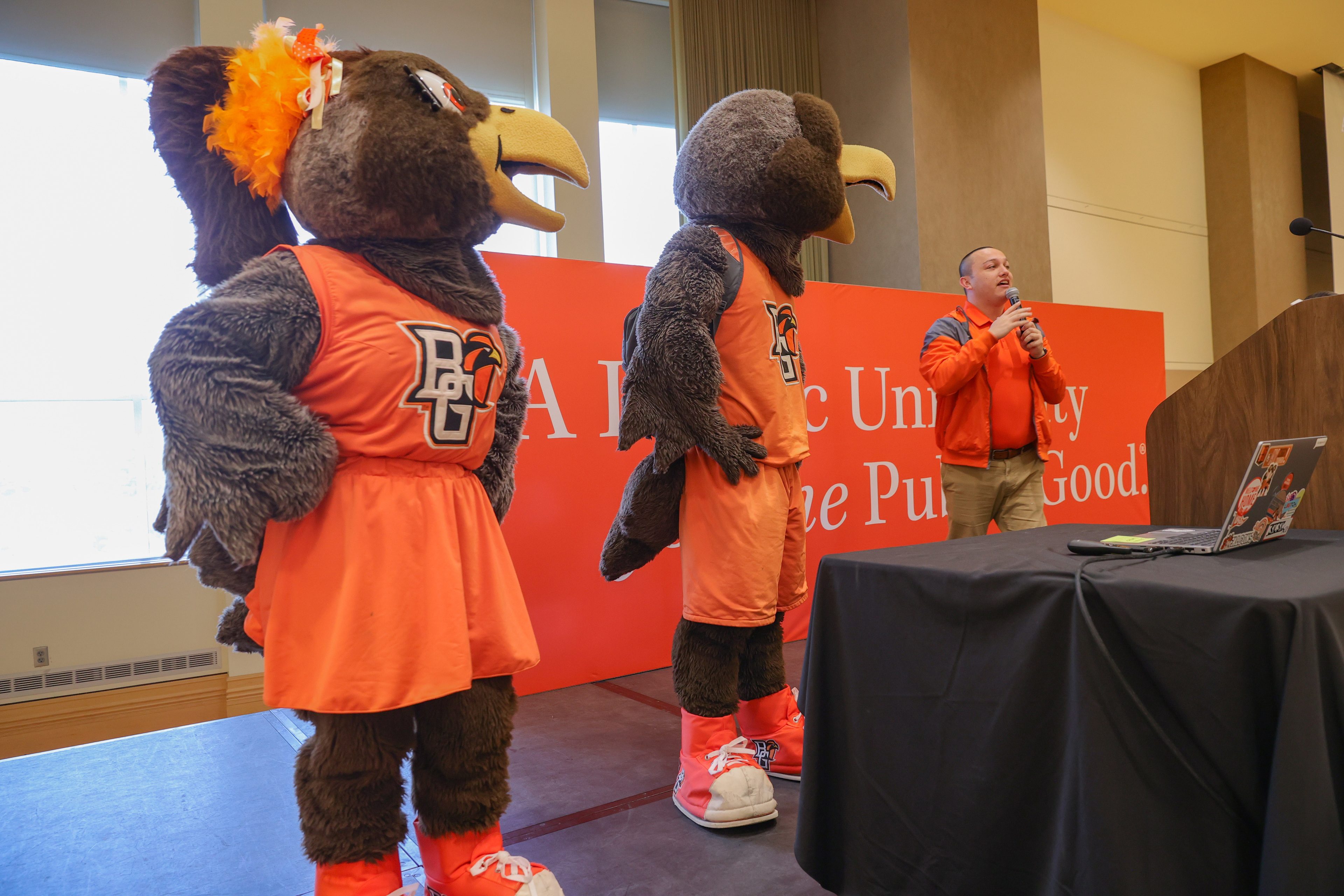 Cheerleading head coach Tyler Bill joins Freddie and Frieda to lead the crowd in a rousing rendition of the University’s official fight song, “Ay Ziggy Zoomba.”